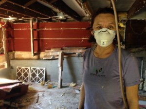 Monica helps with demolition.